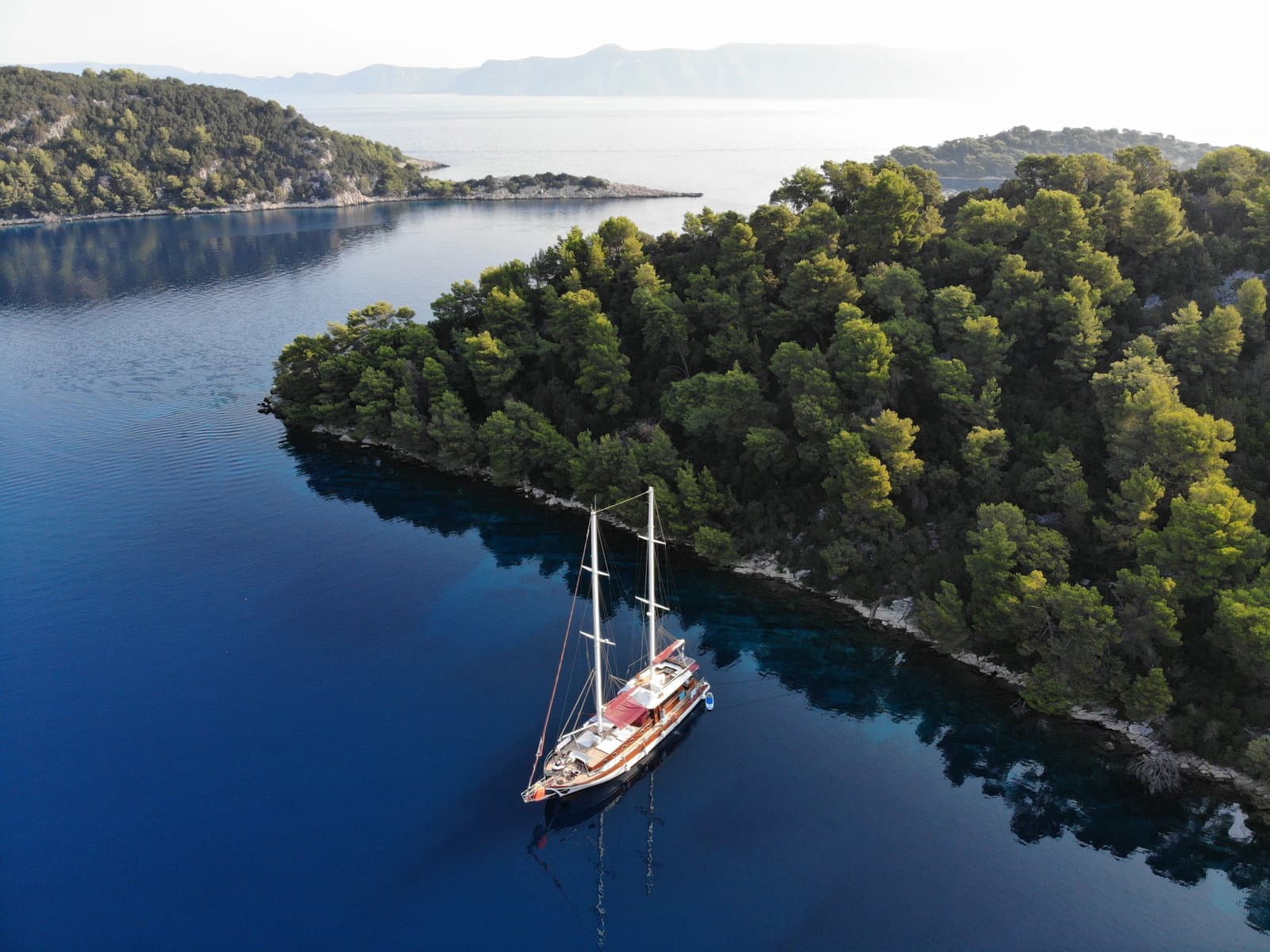 The gulet anchored in a perfectly calm, sheltered Adriatic bay